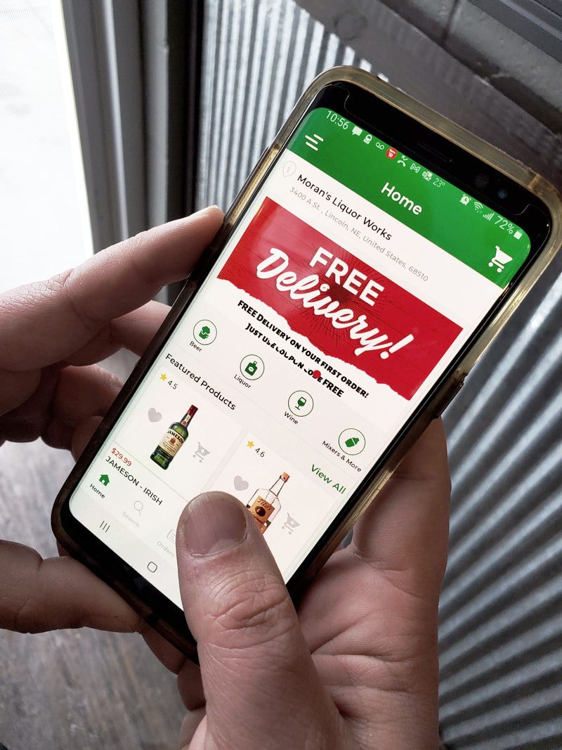 Picture of somebody shopping the Moran's Liquor App, with a banner at the top that says, 